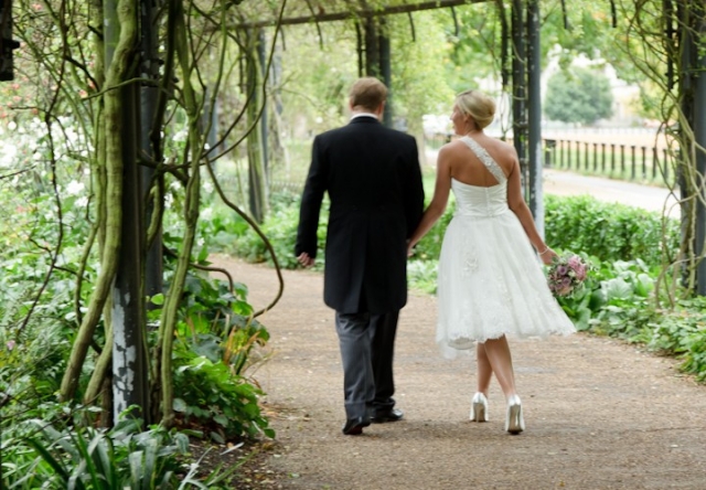 Bride and Groom walk in the park after their Lanesborough Hotel wedding